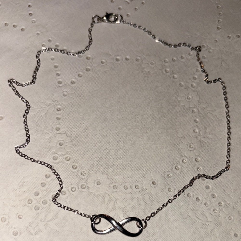 Sterling silver Infinity necklace w/ lobster claw close.   Size in pics. $25